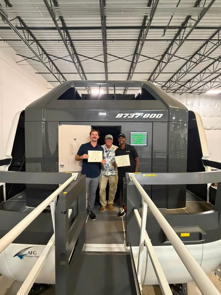Graduates at the B737-800 full-motion simulator at the AVS Miami campus